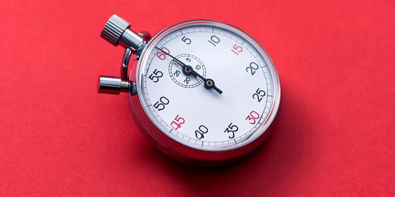 A stopwatch on a red background